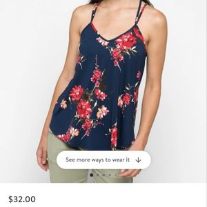 Blue floral Papermoon tank with criss cross straps in the back